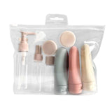 Reusable travel toiletry bottle set in clear bag, featuring leak-proof containers for lotions and cosmetics.