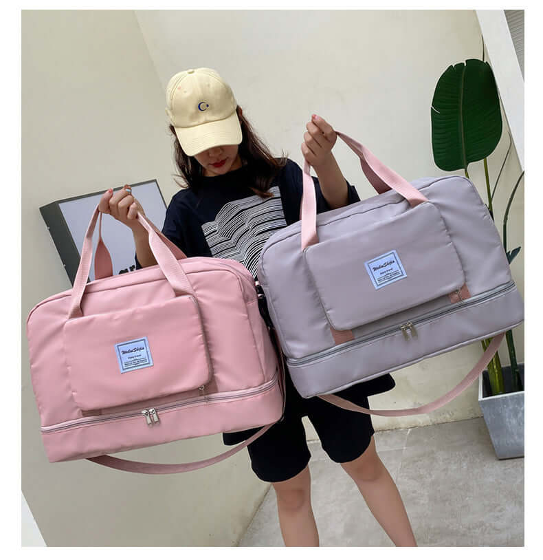 Two medium waterproof travel duffel bags in pink and gray, perfect for weekend getaways and gym sessions.