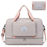 Medium waterproof travel duffel bag in beige with pink straps, featuring multiple compartments for organization.