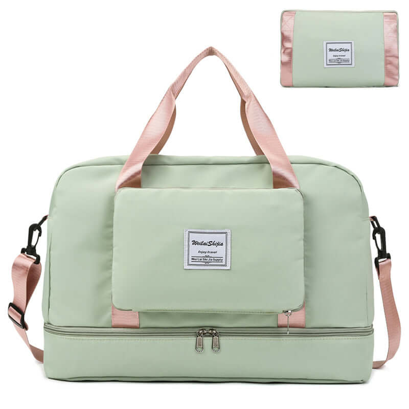 Medium waterproof travel duffel bag in mint green with multiple compartments and adjustable straps.