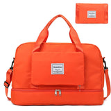 Medium waterproof travel duffel bag in vibrant orange color with detachable pouch.